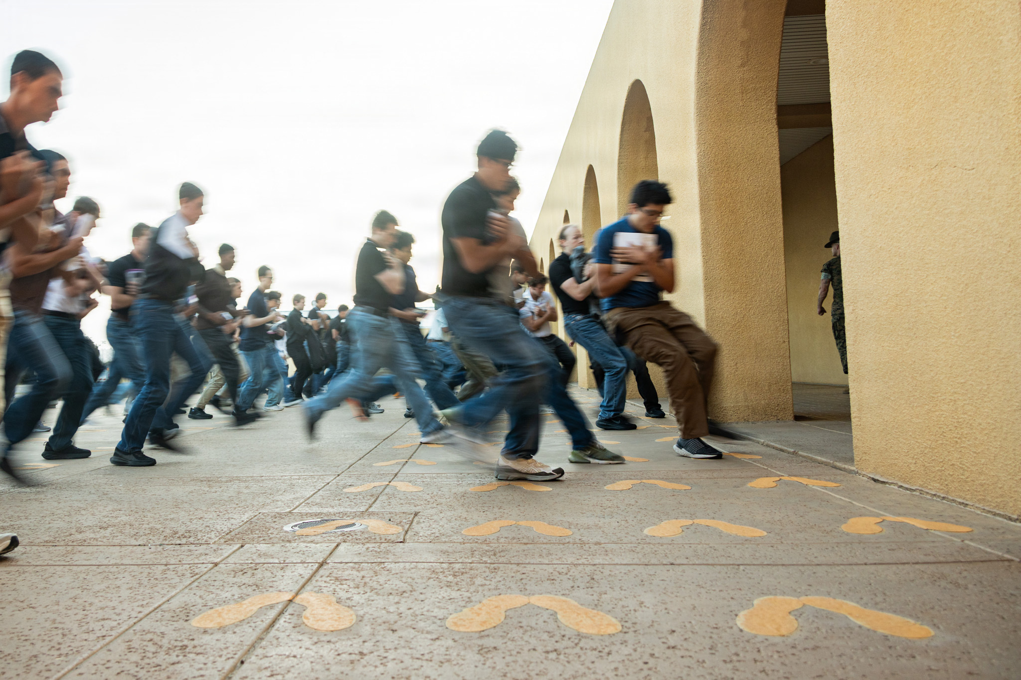 Recruits hitting the yellow footprints at MCRD San Diego