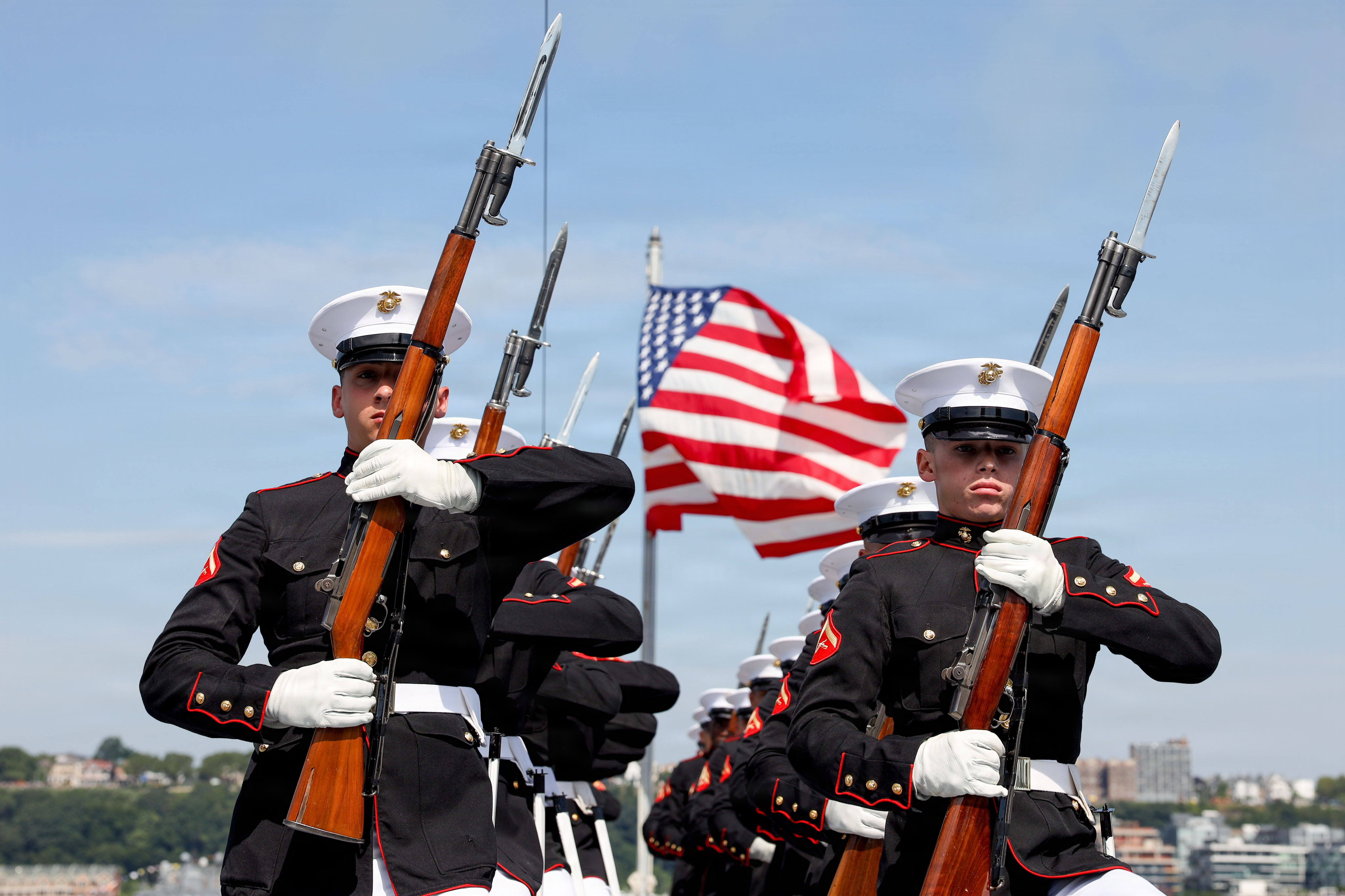 Silent Drill Platoon marching with M1 Garands, flag behind